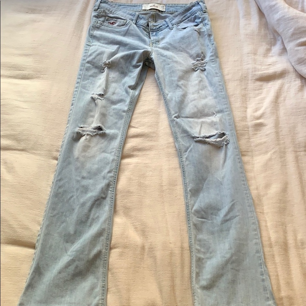 Low rise light wash distressed flare jeans